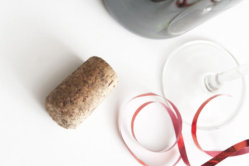 Wine cork lying on white table, daylight
