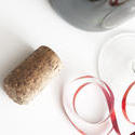 11593   Wine cork lying on white table
