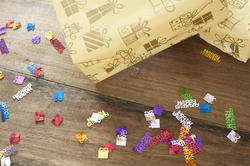11473   Birthday Gifts and Confetti on Wooden Table