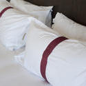 8928   White pillows with decorative bands