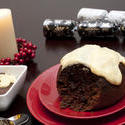 8645   Serving of Christmas pudding and brandy custard