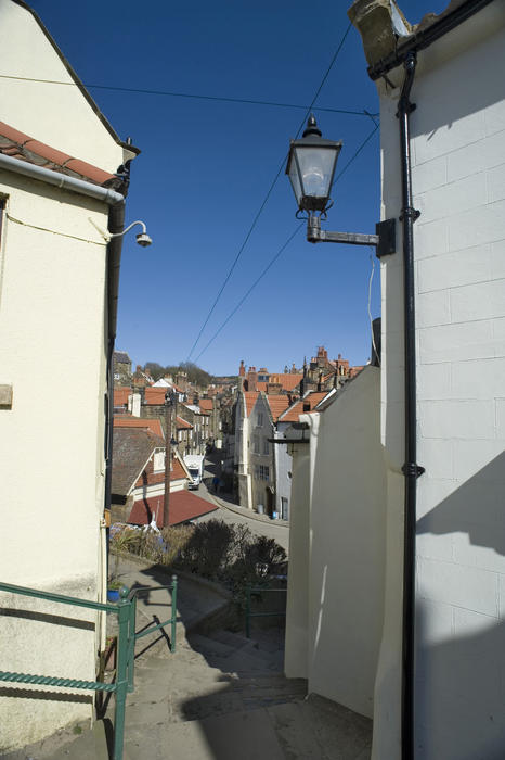 Steps leading down into a quaint english village, robin hoods bay, north yorkshire