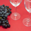 11659   Grapes on Red Background with Empty Wine Glasses