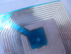 11115   Detail of Blue and Silver Radio Frequency ID Tag