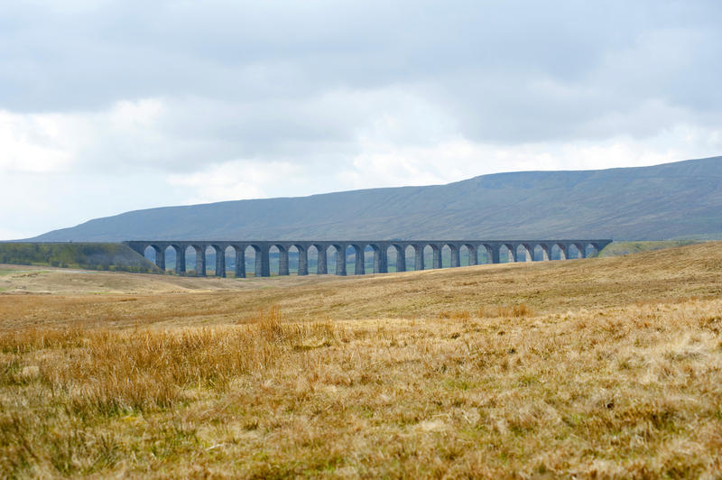 Landscape view of the historic Ribblehead viaduct, a Victorian railway viaduct crossing the River Ribble in North Yorkshire