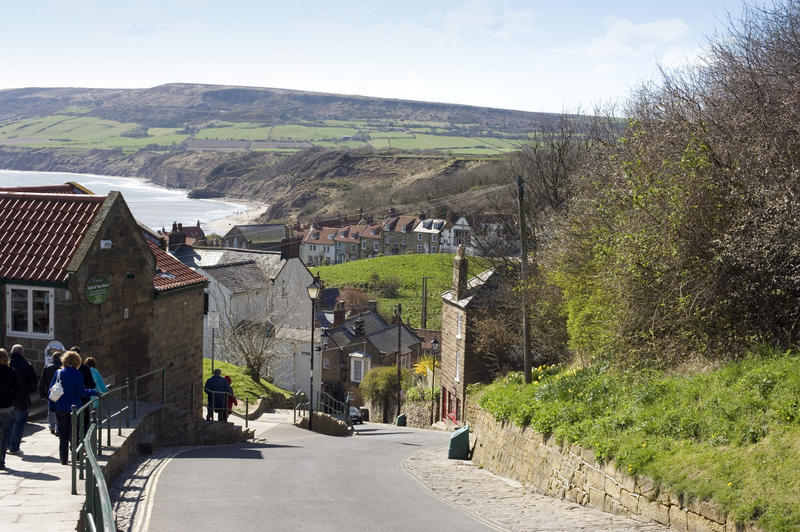 View of the road leading down into the picturesque fishing village of Robin Hoods Bay on the Yorkshire coast in England