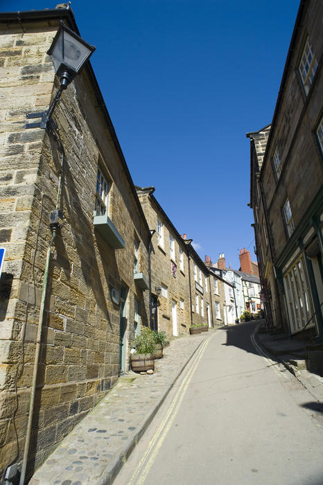 View up the narrow road of Kings Street in Robin Hoods Bay, a fishing village on the Yorkshire coast