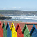 7842   Beach huts at Whitby sands, West Cliff