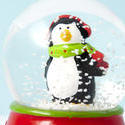8636   Cute little penguin in a shaken snow globe
