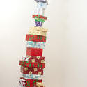 8673   Tall stacked tower of Christmas gifts