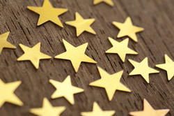 11201   Golden stars isolated on wood