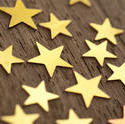 11201   Golden stars isolated on wood