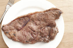 11807   Roasted beefsteak on white plate