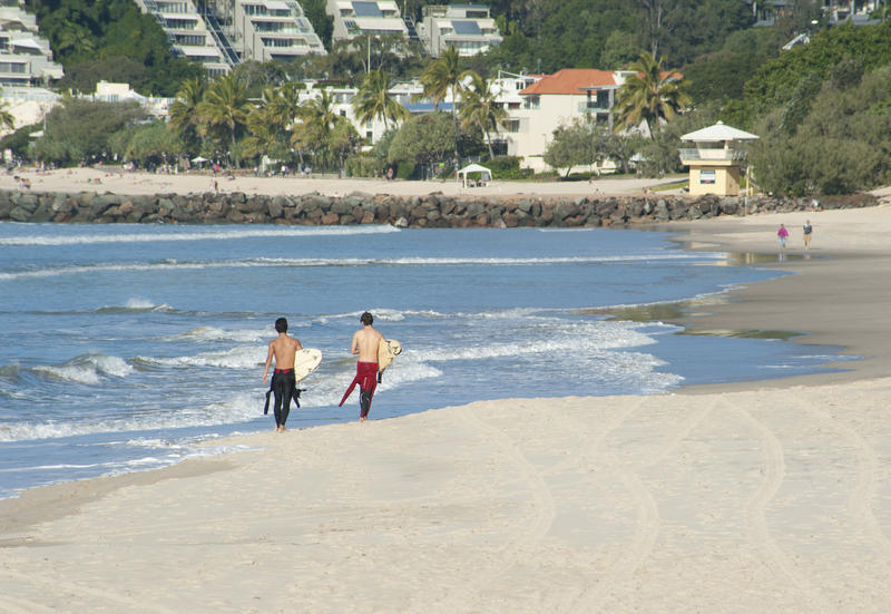 Two Male Surfers at the Beach Holding their Surfing Boards on a Tropical Summer Climate