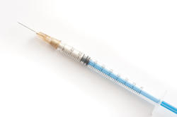 11539   Hypodermic syringe on white