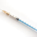 11539   Hypodermic syringe on white