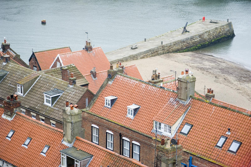 View over rooftops at pier and the water