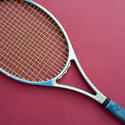 11007   Tennis Racket Isolated on Dark Pink Background