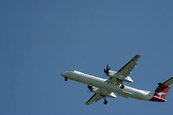 10700   Commercial Qantas airplane flying overhead