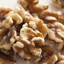 11813   Close Up of Shelled Walnuts on White Background