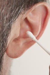 11557   Man Cleaning Ear with Cotton Stick Swab
