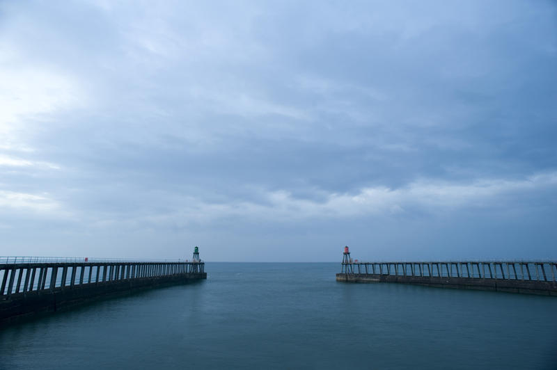 View looking straight out to sea between the two breakwater navigation beacons at Whitby harbour