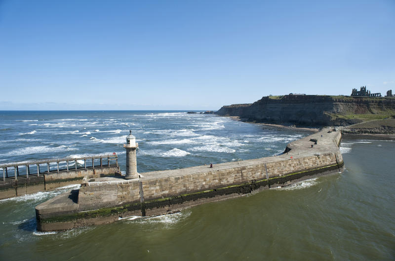 High angle view of the stone walled in Whitby piers that have been in existence since 1632 when they replaced the old wooden piers that once to protect the harbour