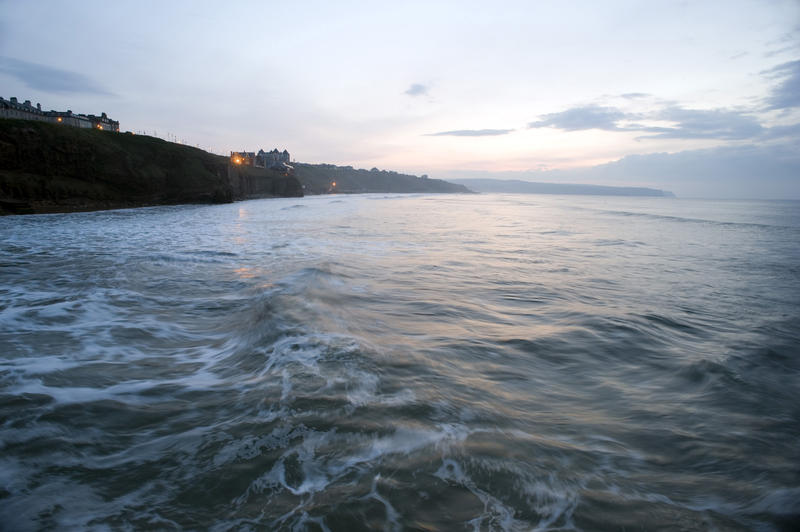 View of the village of Sandsend from the sea at dusk