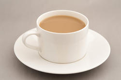 11627   Cup of coffee with milk on saucer