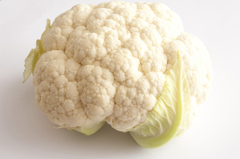 Whole white cauliflower on white background. Isolated