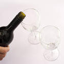 10471   Male hand serving wine into two clean glasses