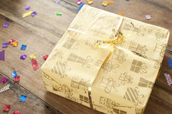 11416   Yellow Present on Wooden Table with Confetti