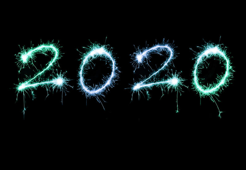 2020 New Years greeting design with sparkling blue date over a black background with copy space for your holiday message