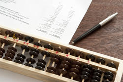 12722   Business balance sheet with abacus and pen