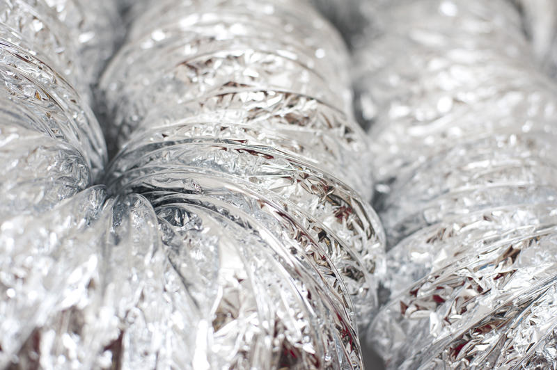 a background of ribbed metal foil 'space blanket'