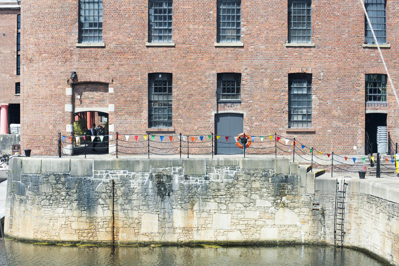 Low tide at Liverpool Albert Dock with railing, stairs and ladder in the United Kingdom