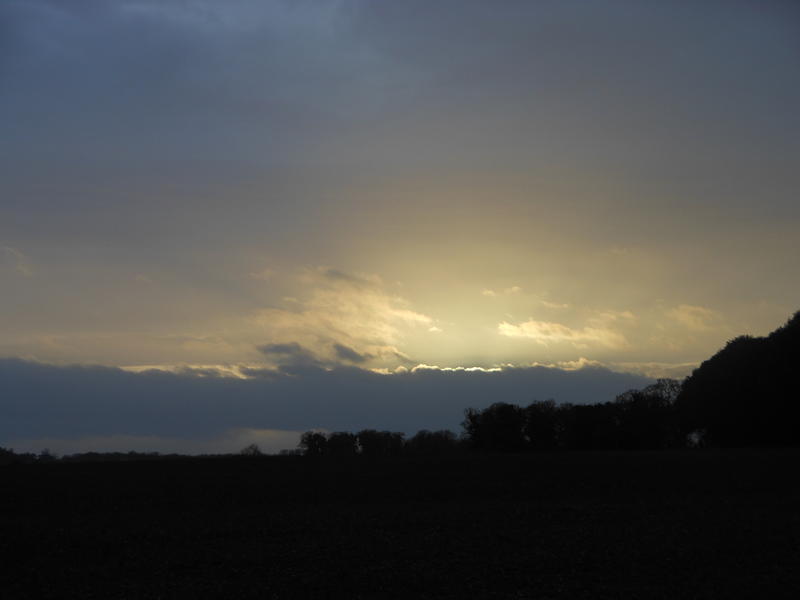 <p>Dark sky backlit by setting sun</p>
