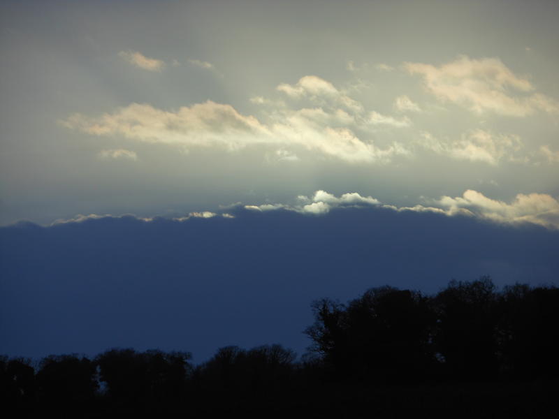 <p>backlit dark cloud bank</p>