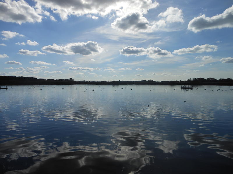 <p>clouds reflected in water</p>
