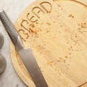 17142   Stainless steel knife and bread board with crumbs