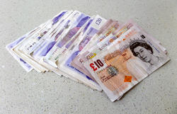 12901   british pound notes on table