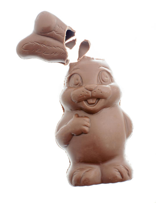Cute fat broken Easter bunny egg with missing ears lying to the side isolated on white