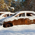 13170   burnt out cars covered in snow