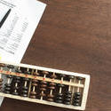 12727   Business finance concept with abacus and statement