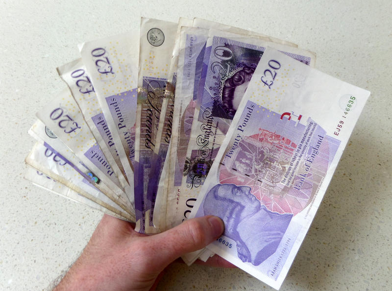 <p>Holding up lots of cash. In a word of cards and money transfers its nice to remember what having a wad of cash is like to treat yourself!</p>
