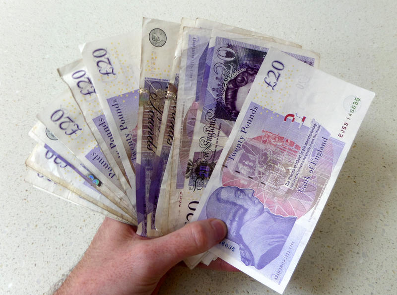 <p>Holding up lots of cash. In a word of cards and money transfers its nice to remember what having a wad of cash is like to treat yourself!</p>
