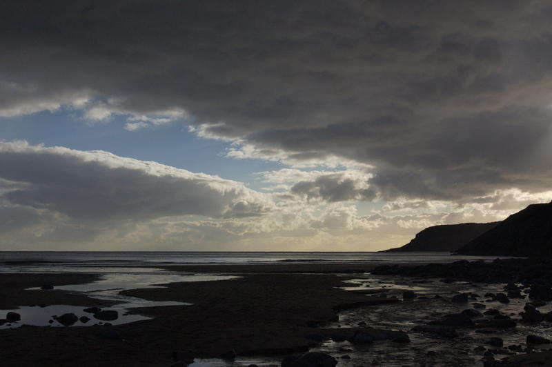 <p>Caswell Bay, in South Wales close to dusk. Shows a coastal stream and the Gower coastline in silhouette<br />
&nbsp;</p>
