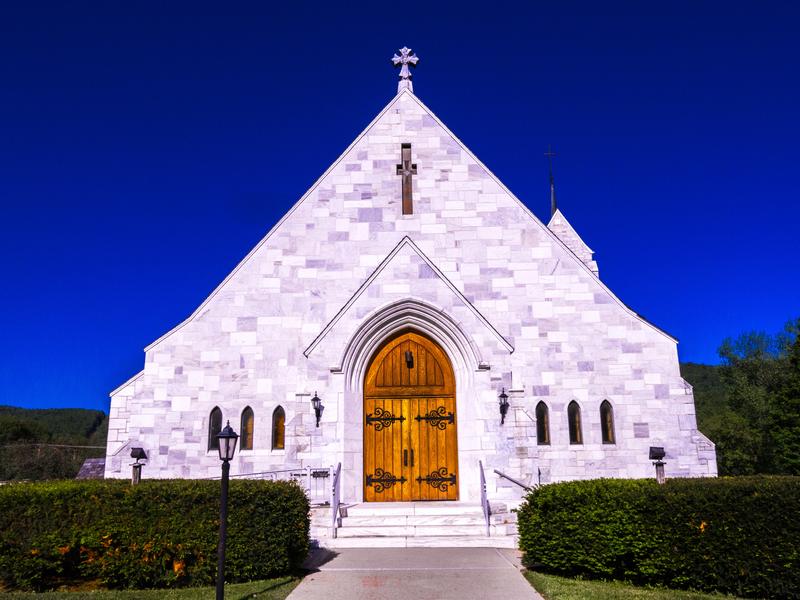 <p>Front of marble stone Catholic Church in Proctor, Vermont. </p>