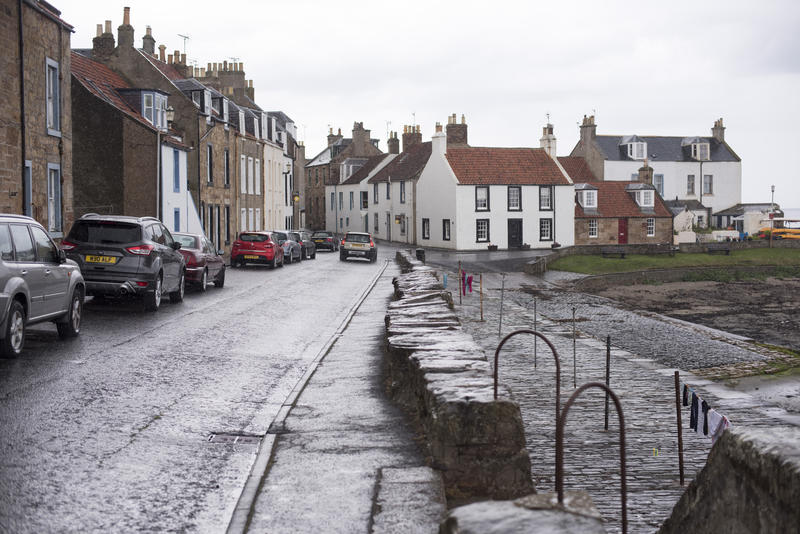 Wet Streets with Traditional White Houses and Parked Cars on Overcast Day, Cellardyke, Fife, Scotland