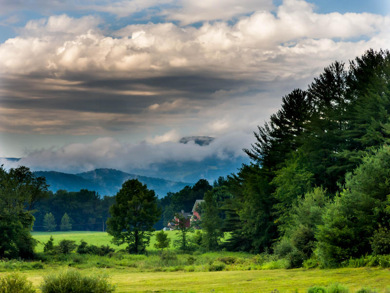 <p>Storm clouds and fog in rural Vermont valley.</p>